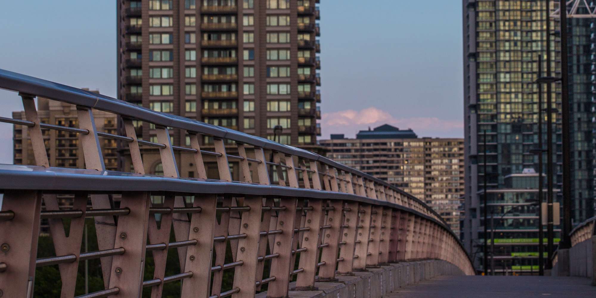 Modern condo towers at dusk in City Centre Mississauga