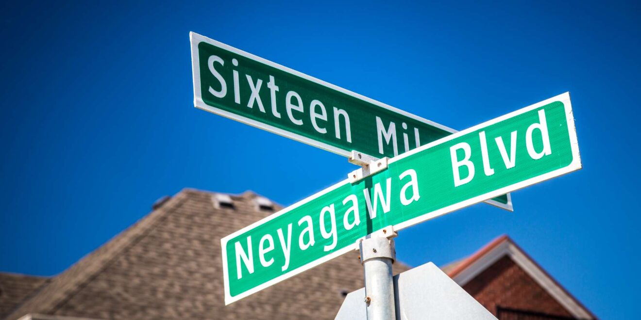 Street signs at Sixteen Mile Drive and Neyagawa Boulevard in Glenorchy Oakville
