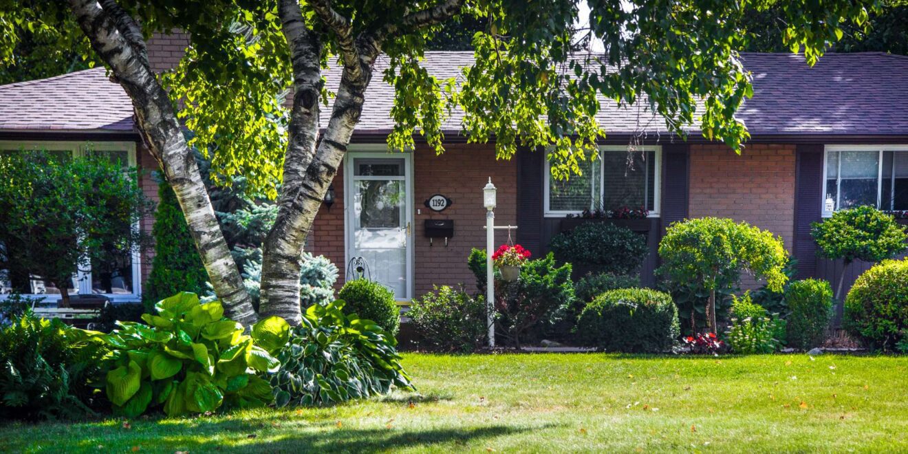 Mature Falgarwood home exterior with trees in Oakville Ontario