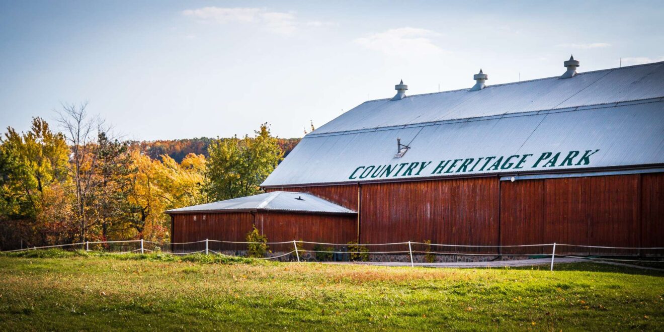Country road with open fields and farmland showing the pastoral setting of Milton Heights, Milton