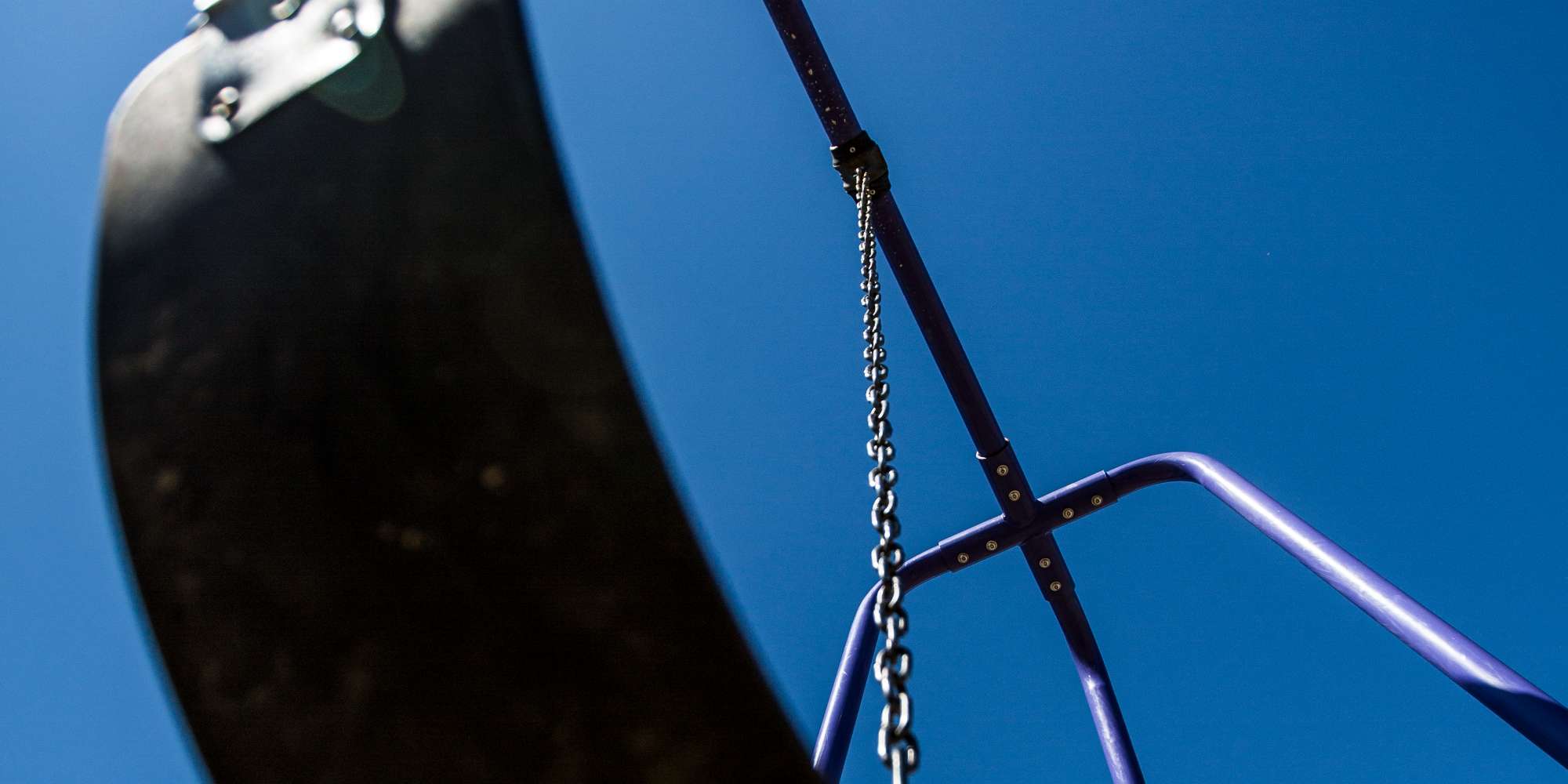 Playground swing set in Churchill Meadows neighbourhood park Mississauga